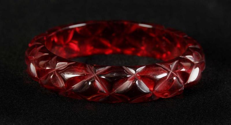 Appraisal: Bakelite Cherry Juice Carved Quilted Bracelet Condition Excellent Size -