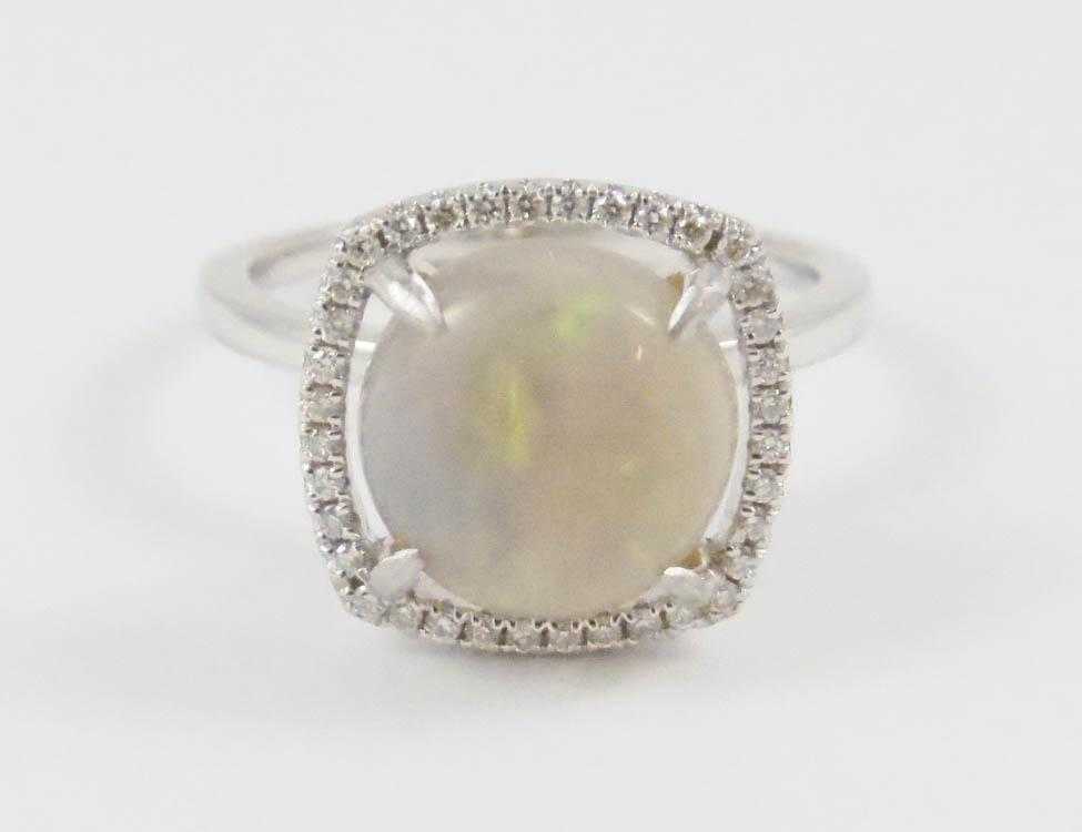 Appraisal: OPAL DIAMOND AND FOURTEEN KARAT GOLD RING The white gold