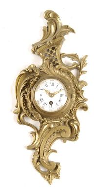 Appraisal: A French gilt brass cartel timepiece with a platform cylinder