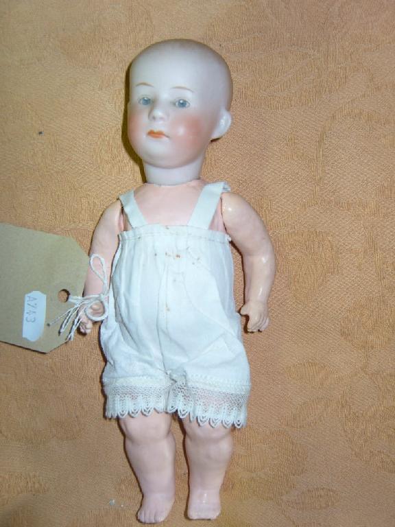 Appraisal: A small German bisque headed character baby doll with painted