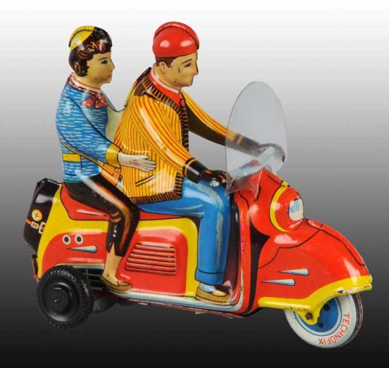 Appraisal: Tin Techno-Fix Motorcycle Friction Toy Description German Working Double rider