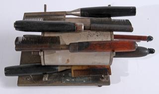 Appraisal: Barber Shop hot comb and utility devise seven different combs