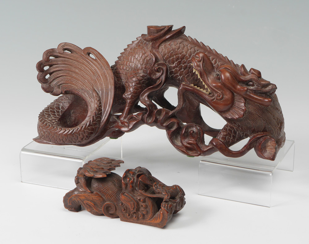 Appraisal: CHINESE CARVED WATER DRAGON FOO DOG pieces total to include