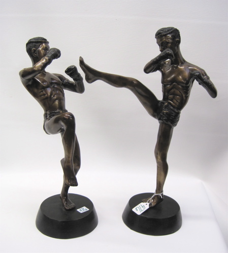 Appraisal: PAIR OF BRONZE SCULPTURES two kick boxers with fists raised