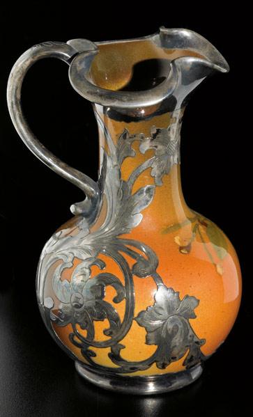 Appraisal: ROOKWOOD Silver-overlaid Standard glaze pitcher painted by Sallie Coyne with