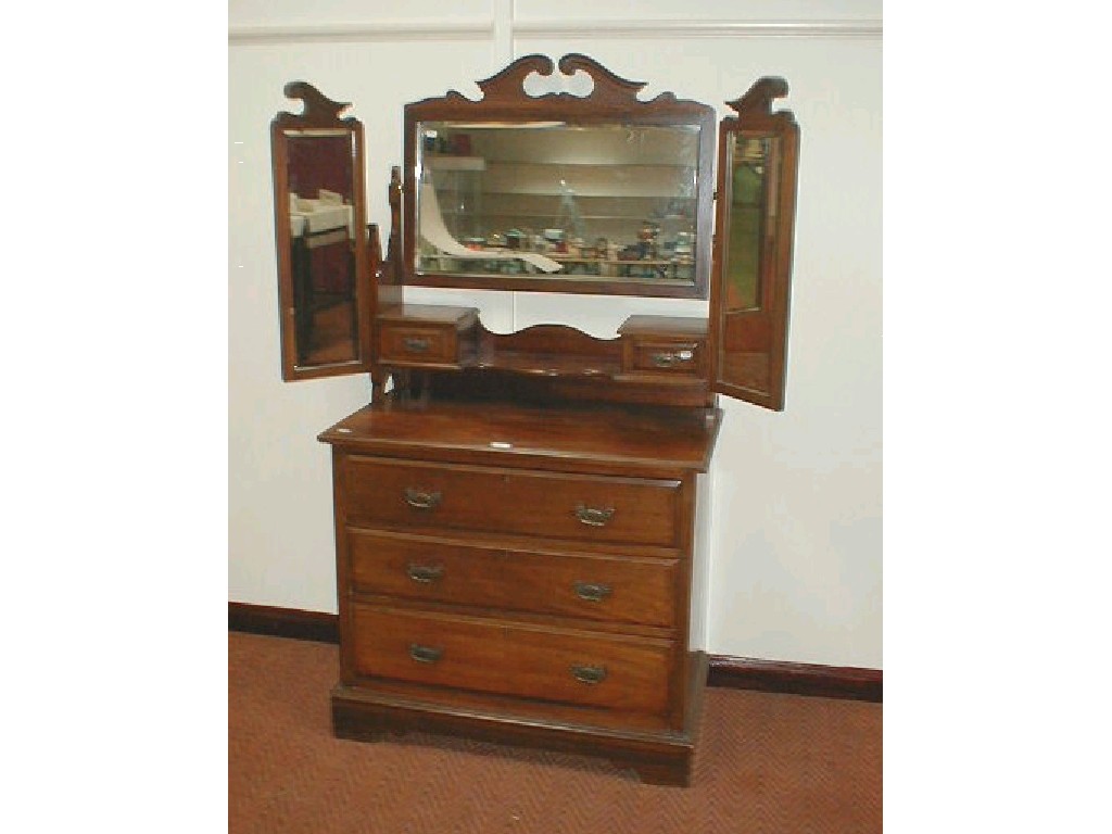 Appraisal: A late Victorian walnut dressing chest with triple mirrors three