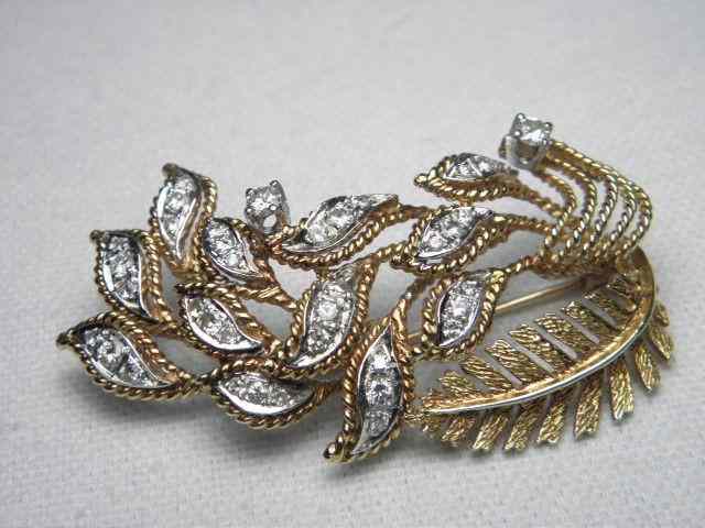 Appraisal: K Gold floral diamond spray pin Includes diamonds in a