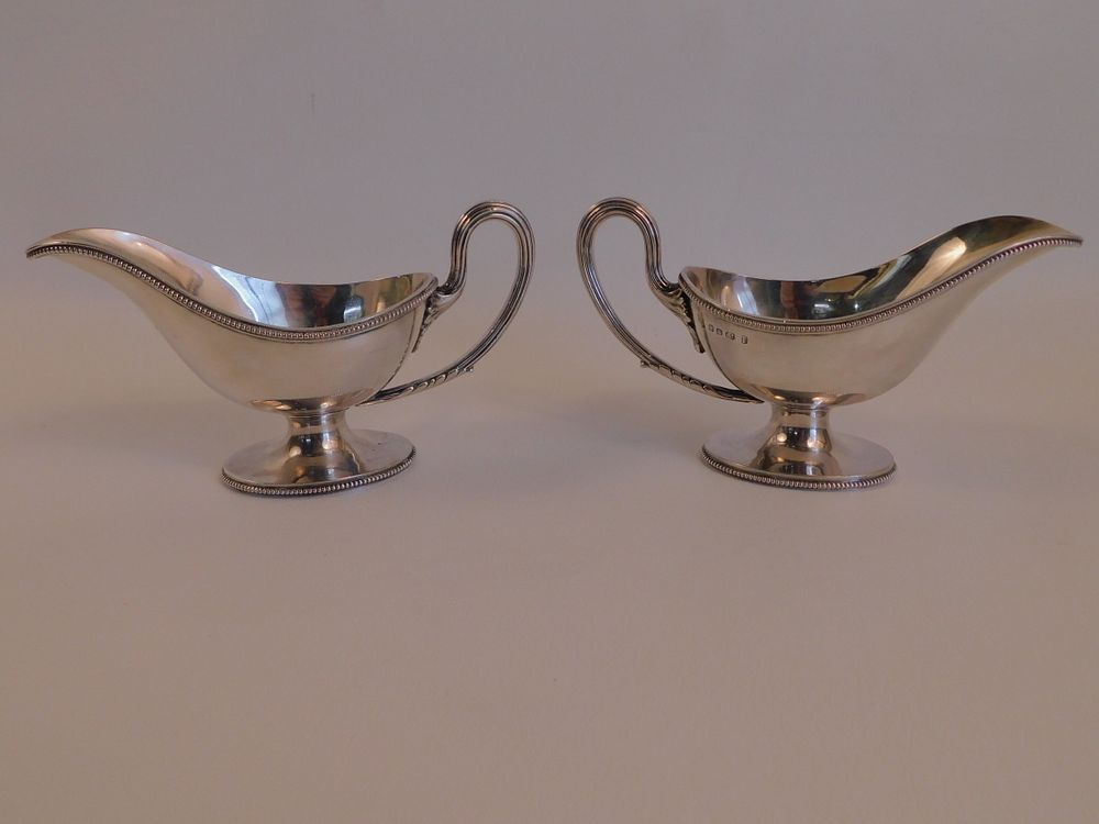 Appraisal: PAIR ENGLISH STERLING GRAVY BOATS Pair of antique English sterling