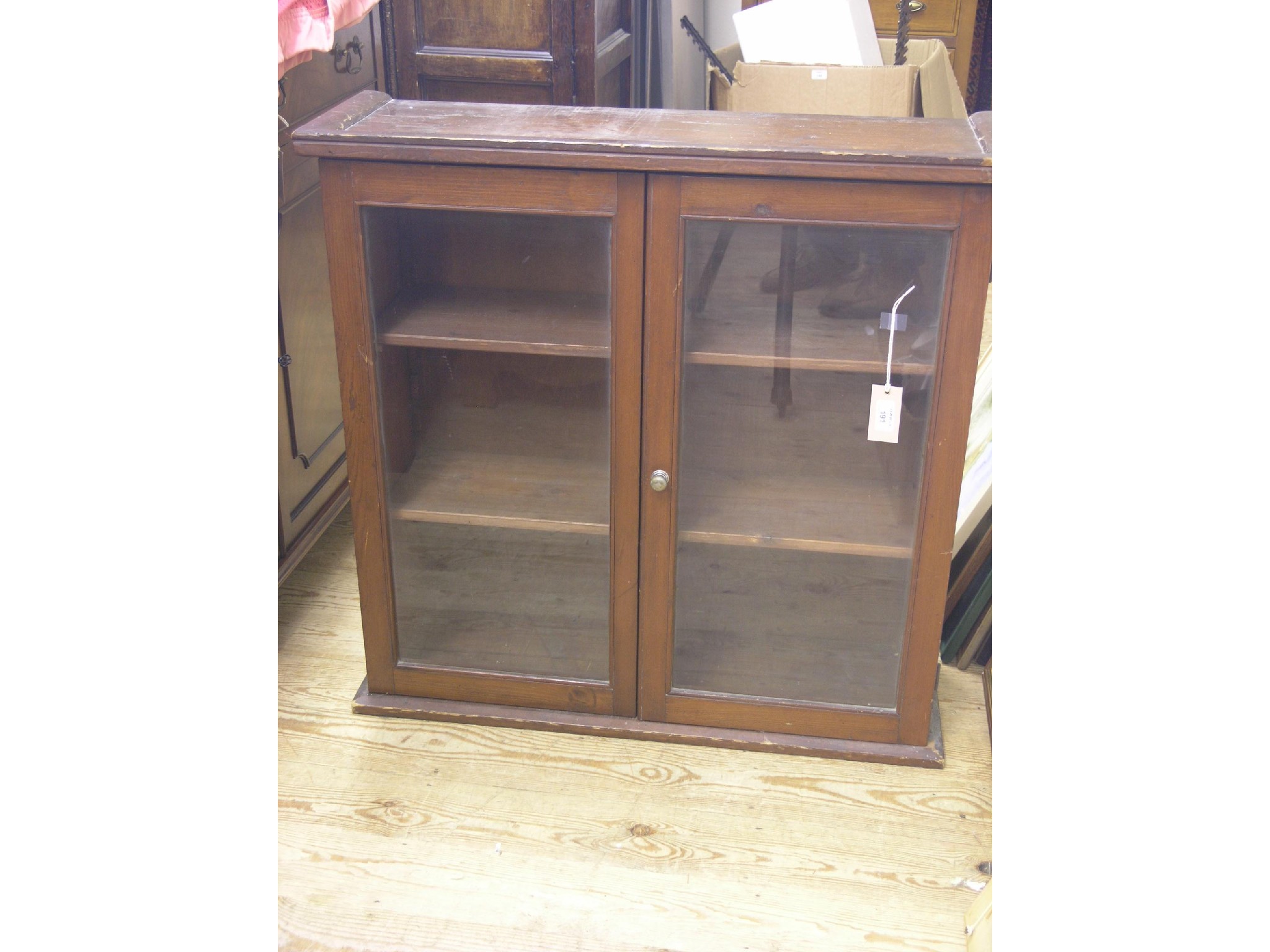 Appraisal: A Victorian stained pine bookcase two adjustable shelves enclosed by