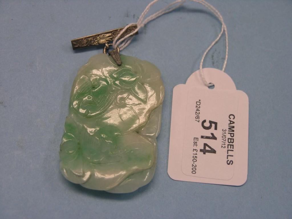 Appraisal: A Chinese spinach-jade pendant carved with birds