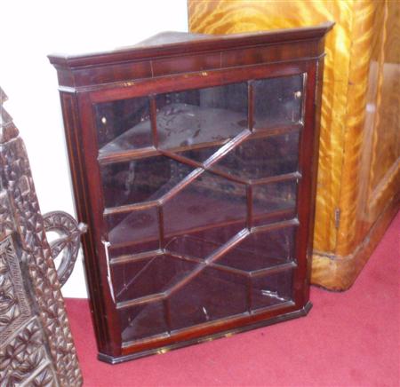 Appraisal: An Edwardian mahogany corner cabinet the plain frieze above an