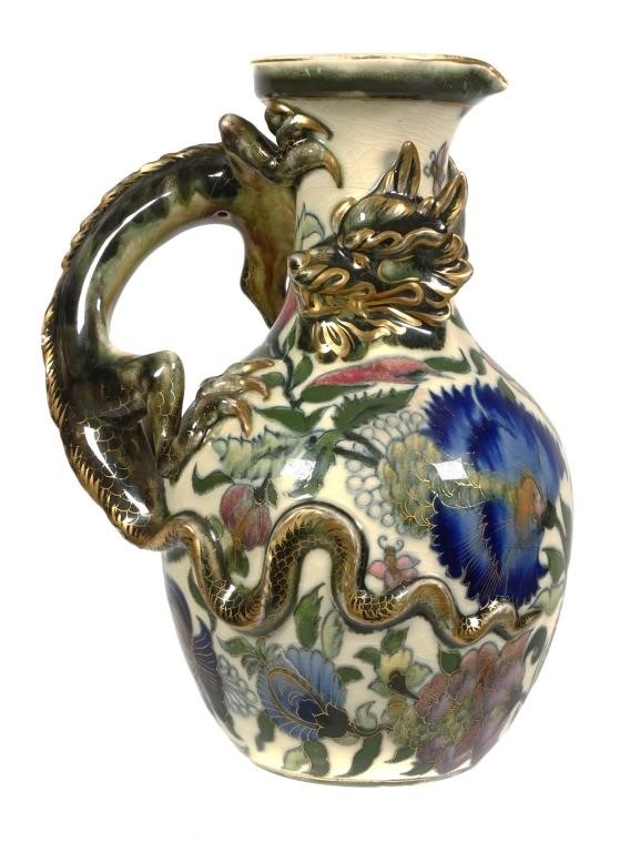 Appraisal: Figural pitcher with reticulated dragon by Zsolnay Underglaze floral polychrome