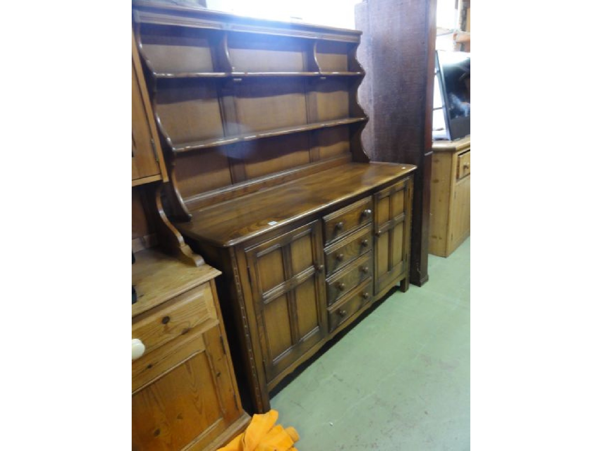 Appraisal: An Ercol Golden Dawn medium elm dresser the base enclosed