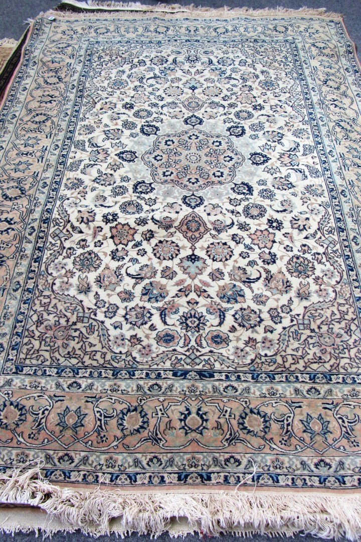 Appraisal: An Isfahan rug Persian the ivory field with a pale