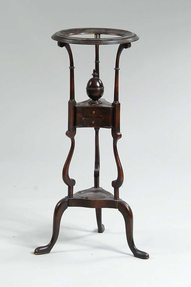 Appraisal: GEORGE II STYLE MAHOGANY WASH STAND The top ring fitted