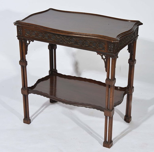 Appraisal: A CHIPPENDALE STYLE MAHOGANY TWO TIER OCCASIONAL TABLE with shaped