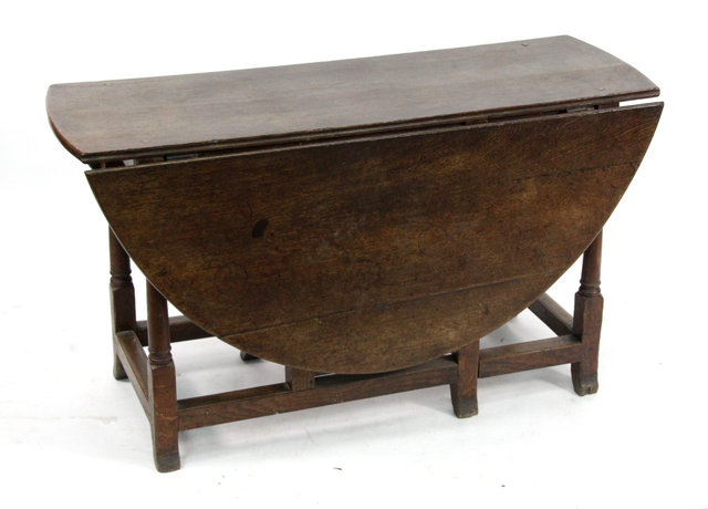 Appraisal: A Jacobean oak gateleg table cm wide with alterations