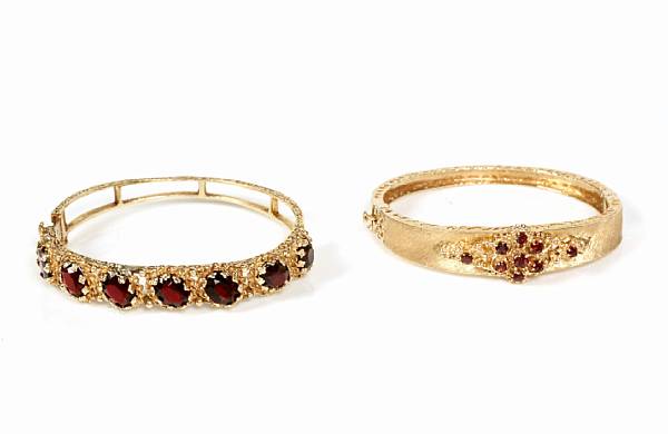 Appraisal: A collection of three stone and gem-set gold bangles grs