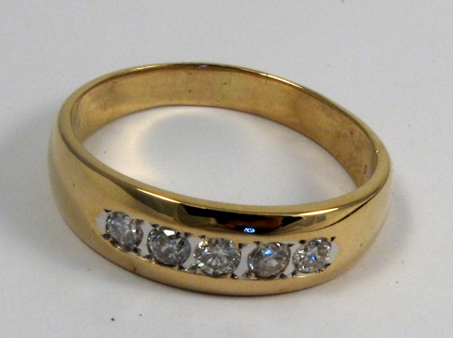 Appraisal: DIAMOND AND FOURTEEN KARAT GOLD RING set with five round