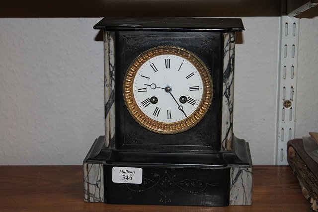 Appraisal: A VICTORIAN BLACK SLATE MANTEL CLOCK with striking mechanism