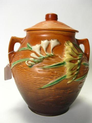 Appraisal: Roseville Pottery lidded handled jar - '' brown Freesia lid