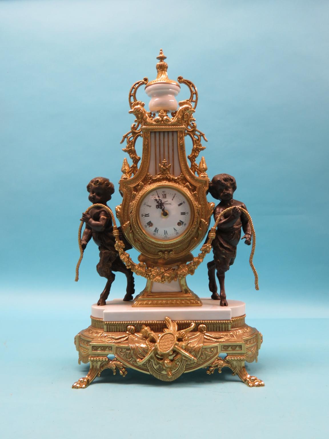 Appraisal: A classical-style ormolu mantel clock with centaur surmounts lyre-shape on