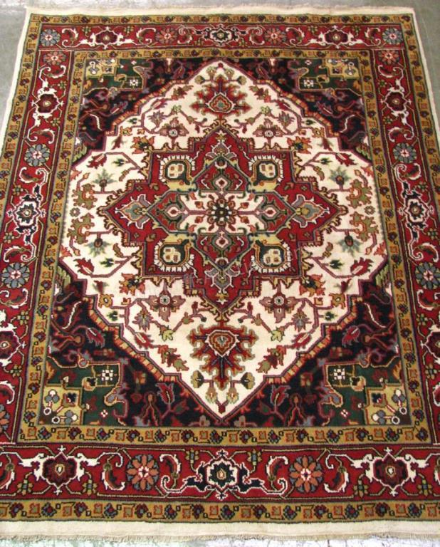 Appraisal: Handmade Oriental Room Size Rug Heriz design cream field with