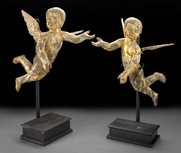 Appraisal: A pair of Continental parcel giltwood cherubs Each modeled in