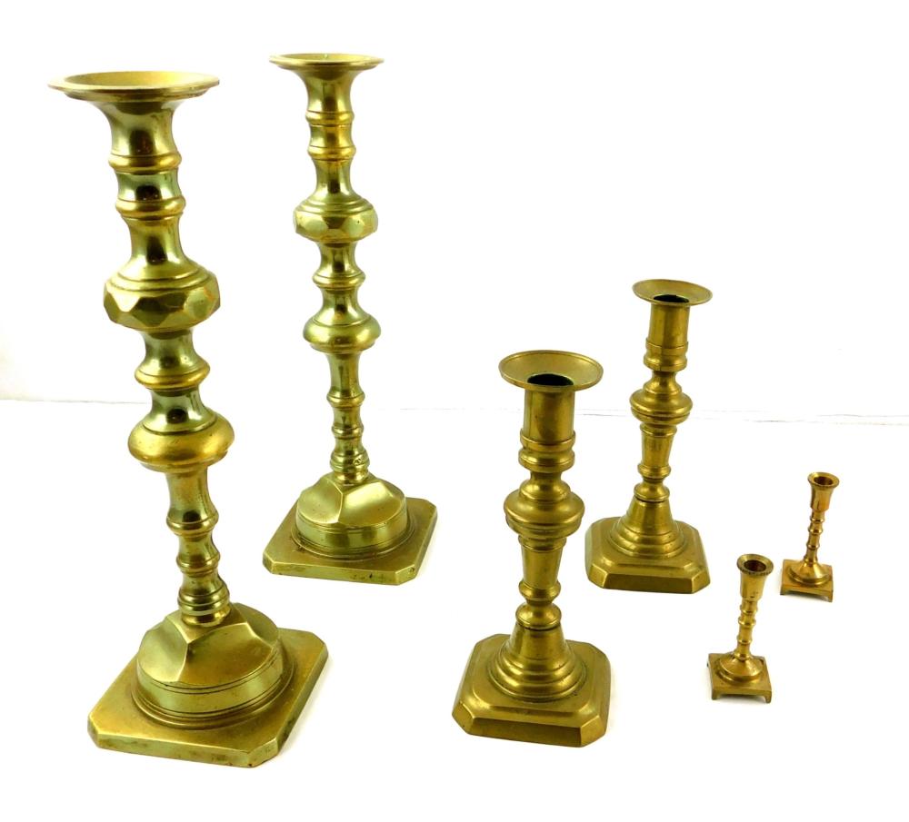 Appraisal: THREE PAIR BRASS ENGLISH CANDLE STICKS LATER TH C LARGER