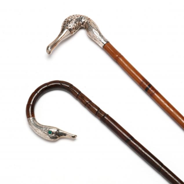 Appraisal: TWO ANTIQUE CONTINENTAL SILVER CANES FIGURING DUCK HANDLES The first