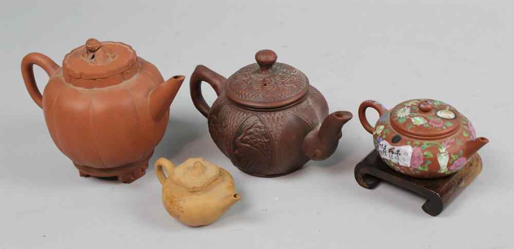 Appraisal: FOUR SMALL CHINESE YIXING TEAPOTS QING DYNASTY AND LATER including