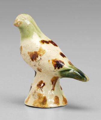 Appraisal: Earthenware bird molded green and brown splash decoration British or