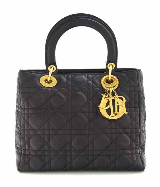 Appraisal: A Christian Dior Black Leather Quilted Bag with double top