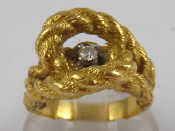 Appraisal: A yellow metal tests carat gold rope ring set with