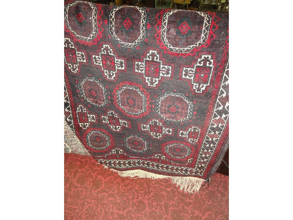 Appraisal: A Bokhara type carpet with alternating rows of gul and