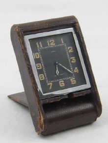 Appraisal: A Jaeger le Coultre day folding travelling clock retailed by