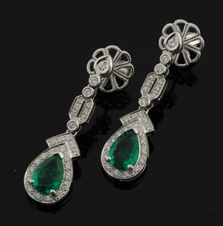 Appraisal: A pair of emerald and diamond drop earrings Each set