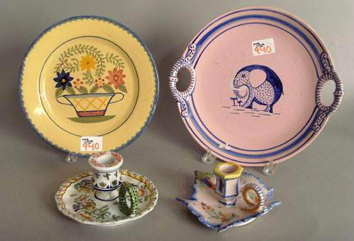 Appraisal: Two Quimper plates together with a Quimper chamberstick and a