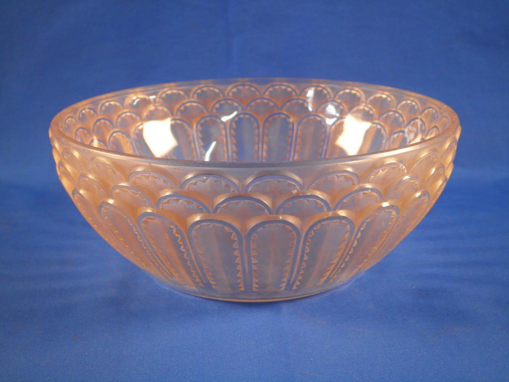 Appraisal: A Lalique red iridescent bowl decorated with rows of stylised