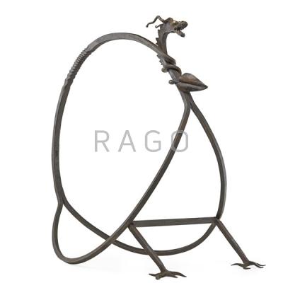 Appraisal: STYLE OF SAMUEL YELLIN Wrought iron log holder Condition Report