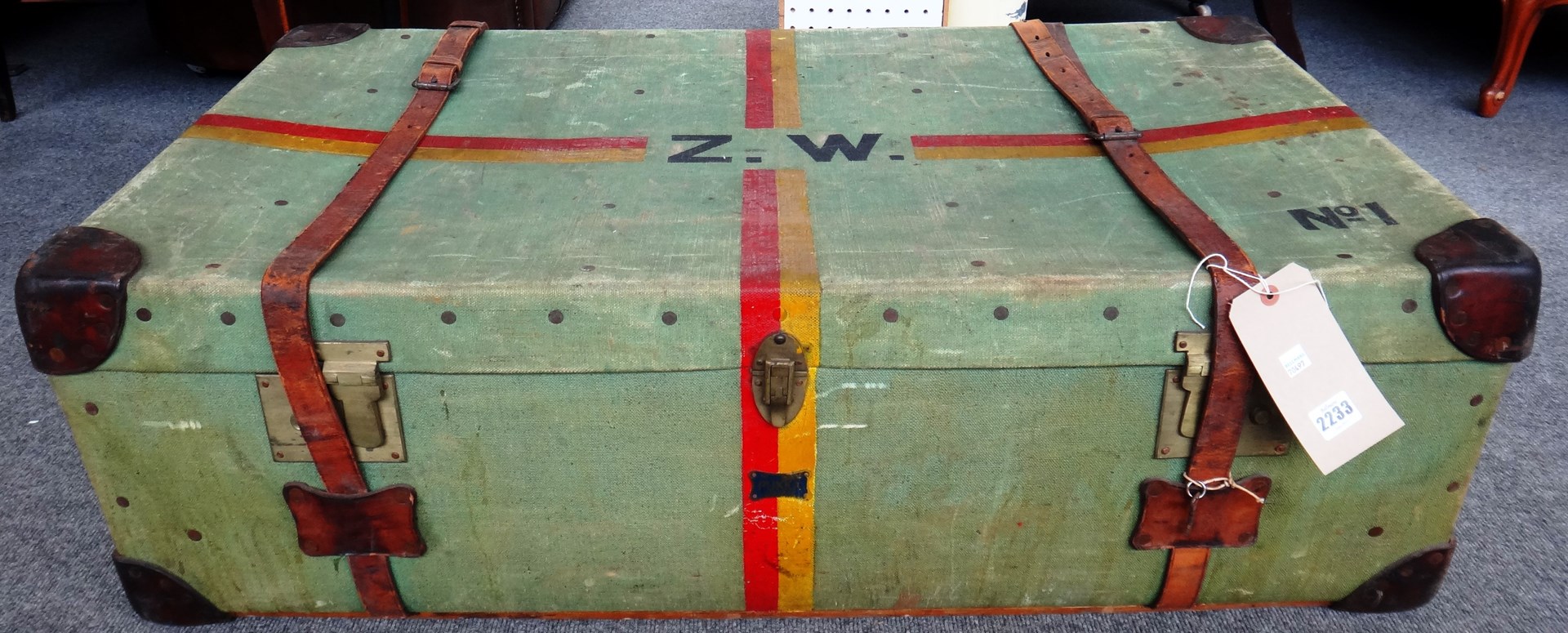 Appraisal: A green canvas and leather bound travel trunk th century