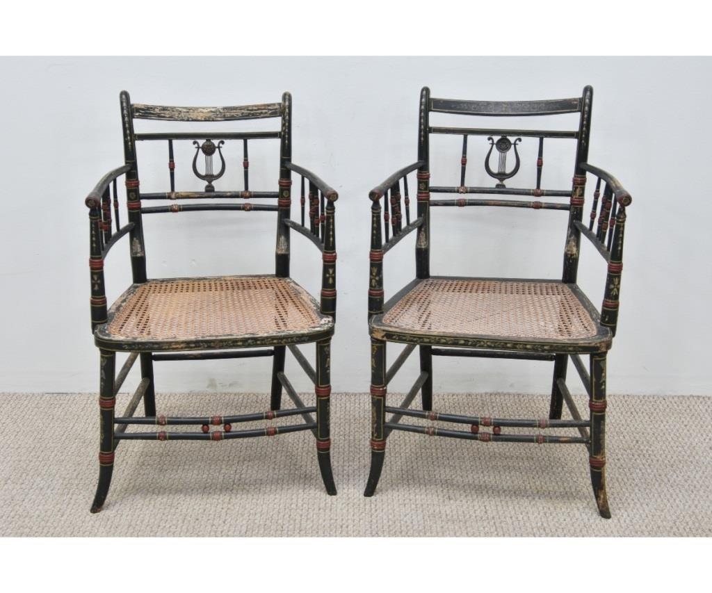 Appraisal: Pair of carved and painted Regency armchairs th c caned