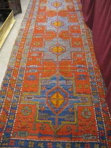 Appraisal: Heriz Persian Handmade Runner goemetric designs red field floral borders