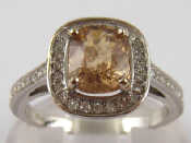 Appraisal: A white metal tests carat gold yellow sapphire and diamond