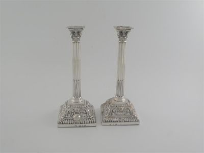 Appraisal: A pair of George III Corinthian column tapersticks on domed