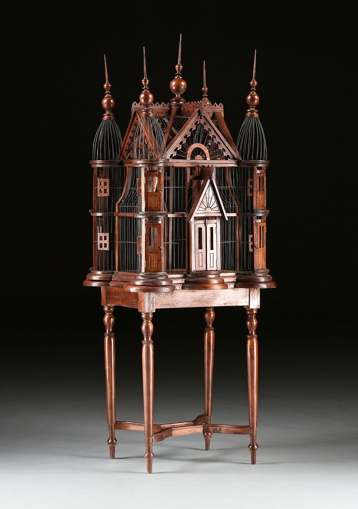 Appraisal: A VICTORIAN STYLE WIRE AND CARVED WOOD CATHEDRAL BIRDCAGE MODERN