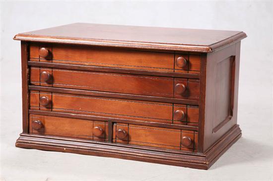 Appraisal: SPOOL CABINET Five drawers with channel carving and paneled sides