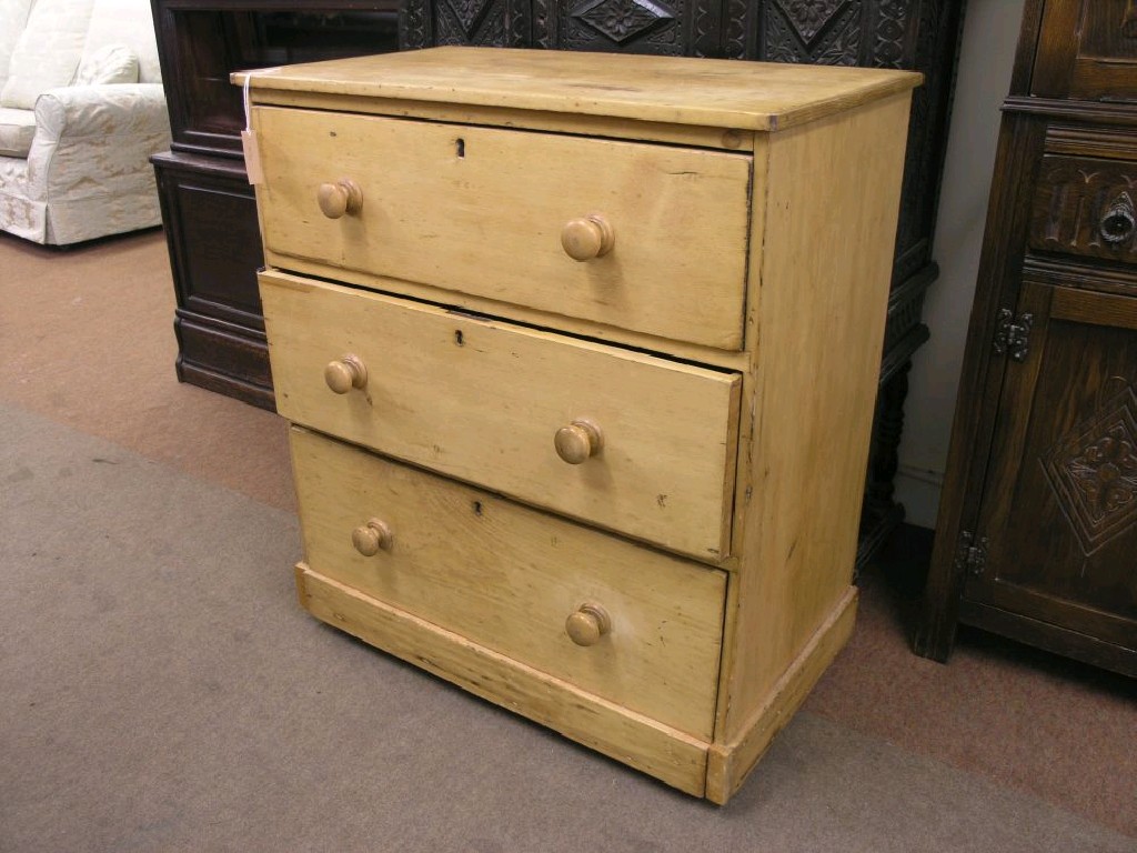 Appraisal: A Victorian stripped pine chest three drawers each with turned