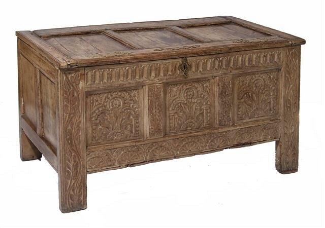 Appraisal: AN ANTIQUE ALPINE LIMED OAK COFFER with hinged rising lid