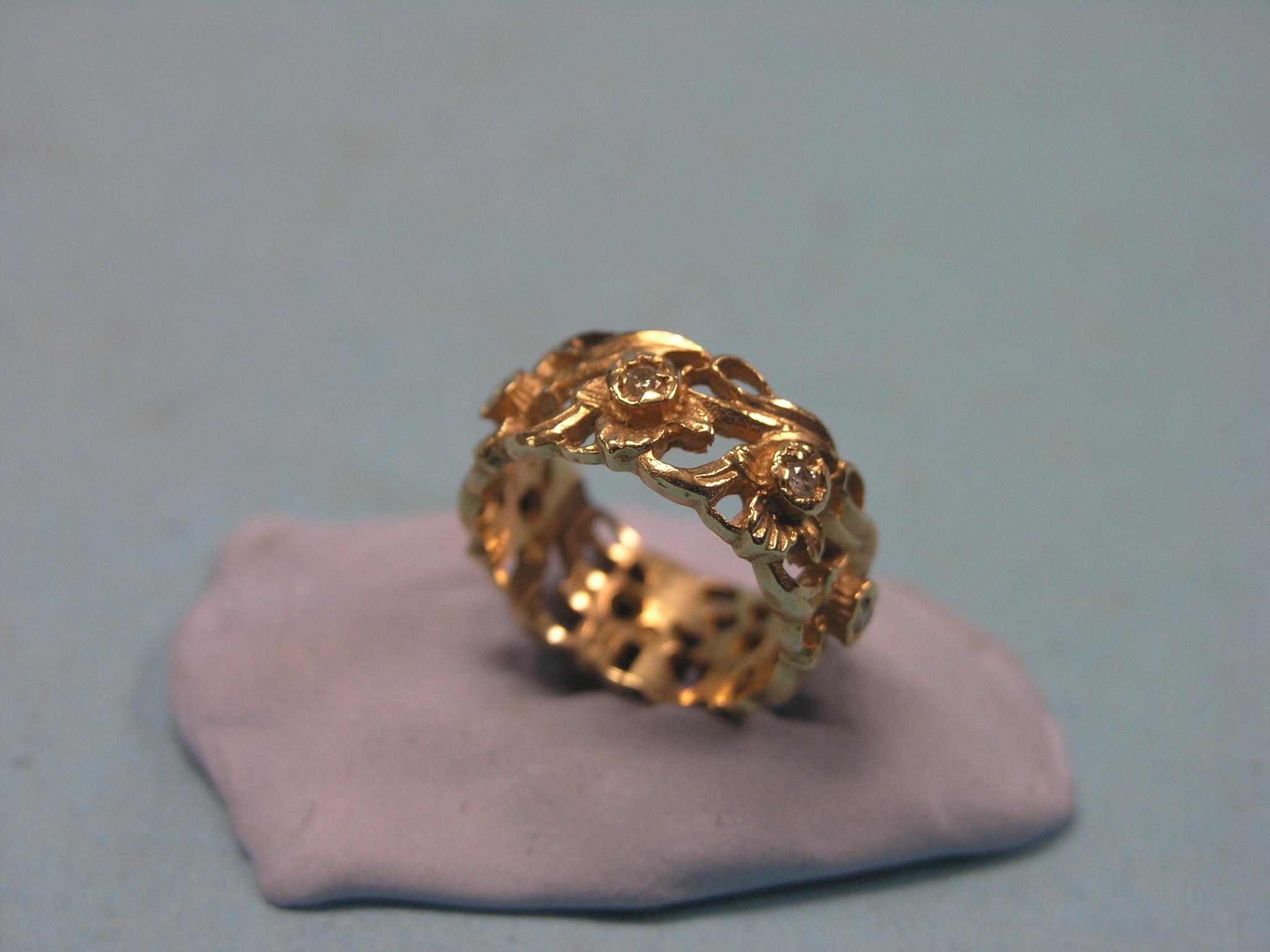 Appraisal: A ct gold and diamond ring set seven small diamonds